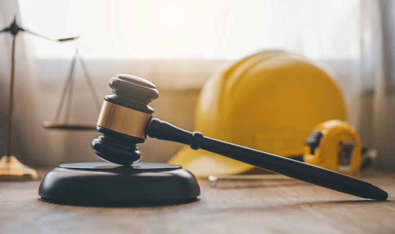 Judge's hammer and helmet Law and Justice about labor law concept Construction law.